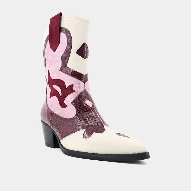 Cowboy boots are renowned for their intricate details, giving them a unique personality. Our ZIZI boots are crafted from top-quality faux leather and embroidered with a Western-style motif, which adds to their authenticity. These boots feature a comfortable slanted heel, making them ideal for long hours of wear. They are available in various colors, allowing you to mix and match them with your outfits. Pink Leather Mid-calf Boots For Winter, Western High-top Boots For Spring, Pink Leather Mid-calf Boots For Fall, High-top Leather Boots For Festival, Pink Ankle-high Western Boots, Pink Western Ankle-high Boots, Pink High-top Leather Boots, Pink Snip Toe Boots For Winter, Trendy Pointed Toe Festival Boots