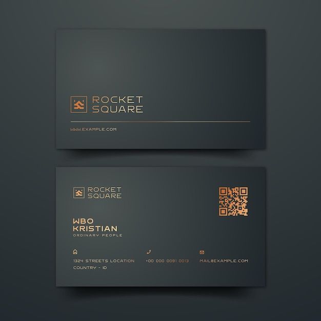 a black and gold business card on a dark background