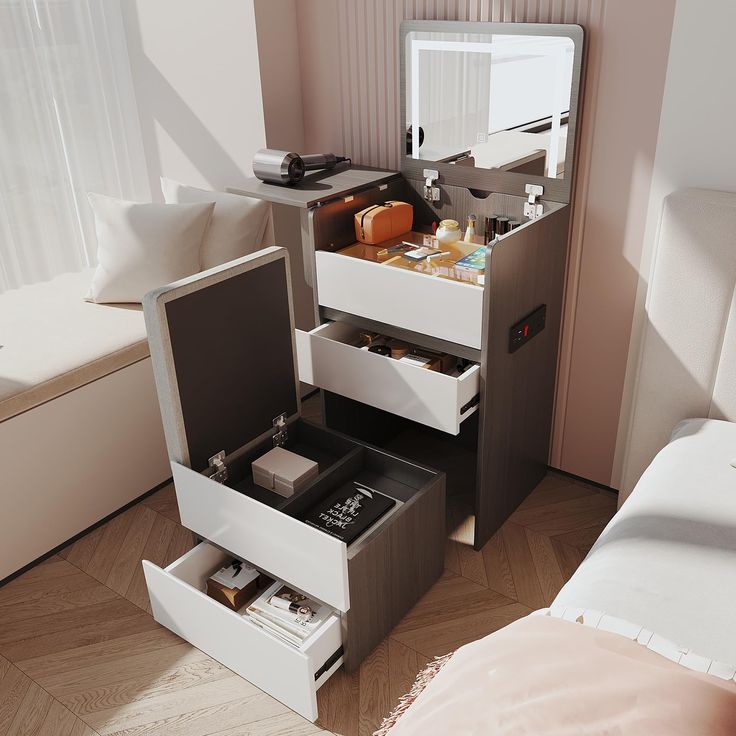 an open drawer in the middle of a bed next to a dresser with drawers on it