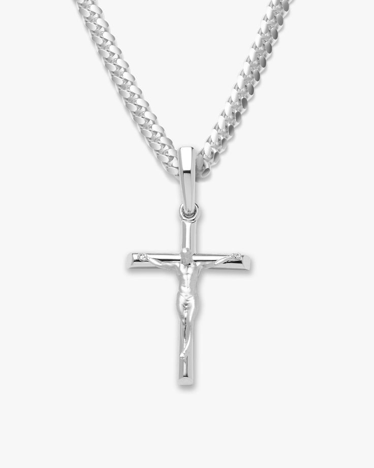 Choose the pendant that best expresses your beliefs. The silver Crucifix Pendant is one of the newest additions to our men’s pendant collection. We’ve crafted this silver pendant with the best materials to create a standout shine and be comfortable as it remains close to your heart. This men’s crucifix pendant necklace is an accessory you’ll never want to take off. See our gold crucifix necklace for a classic alternative. Gold Crucifix Necklace, Crucifix Necklace, Silver Cross Necklace, Solid Gold Chains, Silver Shop, Cuban Link Chain, Men's Rings, Dream Jewelry, Silver Cross