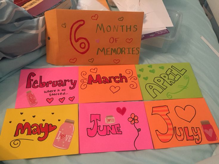 some cards are on a bed with the names of each month and months painted on them