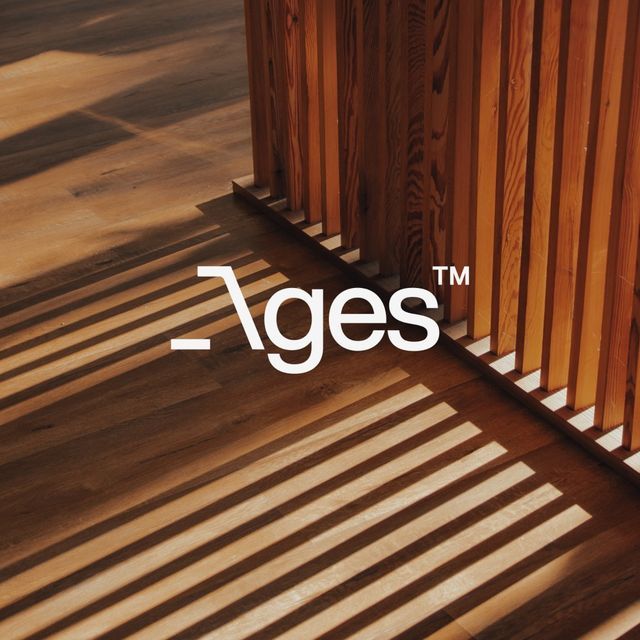 the logo for 7ge's is shown on a wooden wall with shadows from it