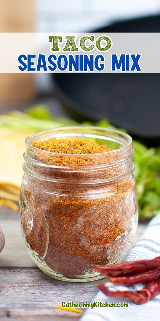 a jar filled with taco seasoning next to other ingredients