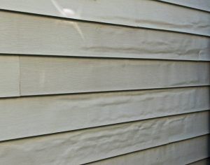 the side of a house with white siding