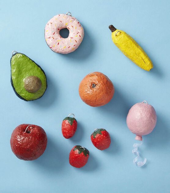 various fruits and vegetables are arranged on a blue surface