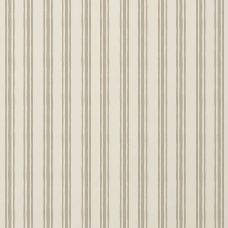 a white and beige striped wallpaper with vertical stripes