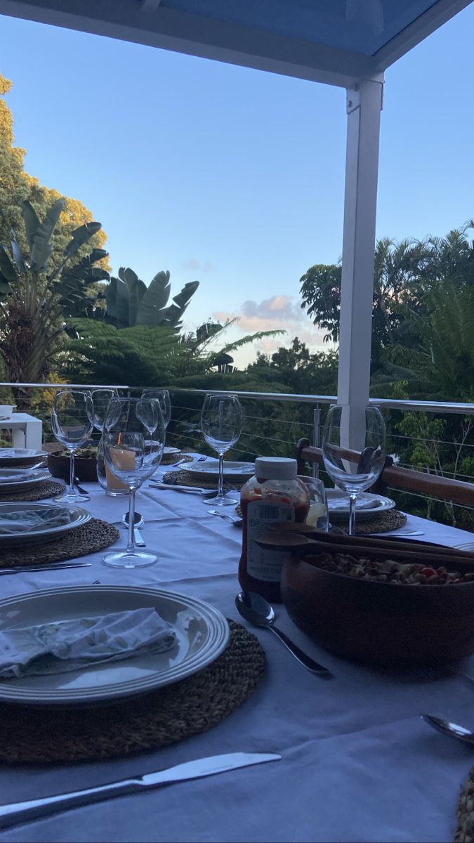 the table is set with plates and silverware