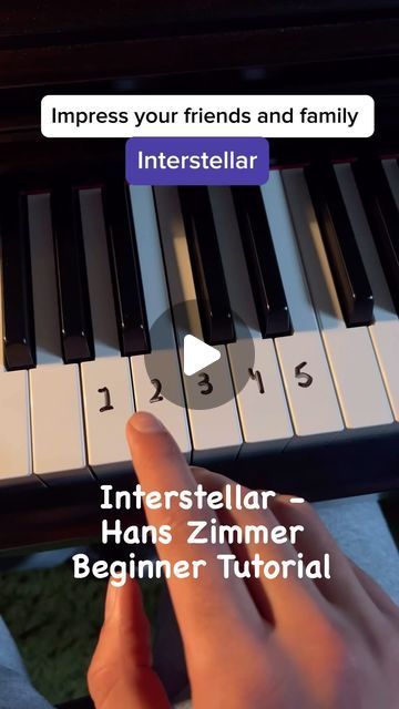 someone is playing the piano with their fingers and finger pressing it to play an intersteular song