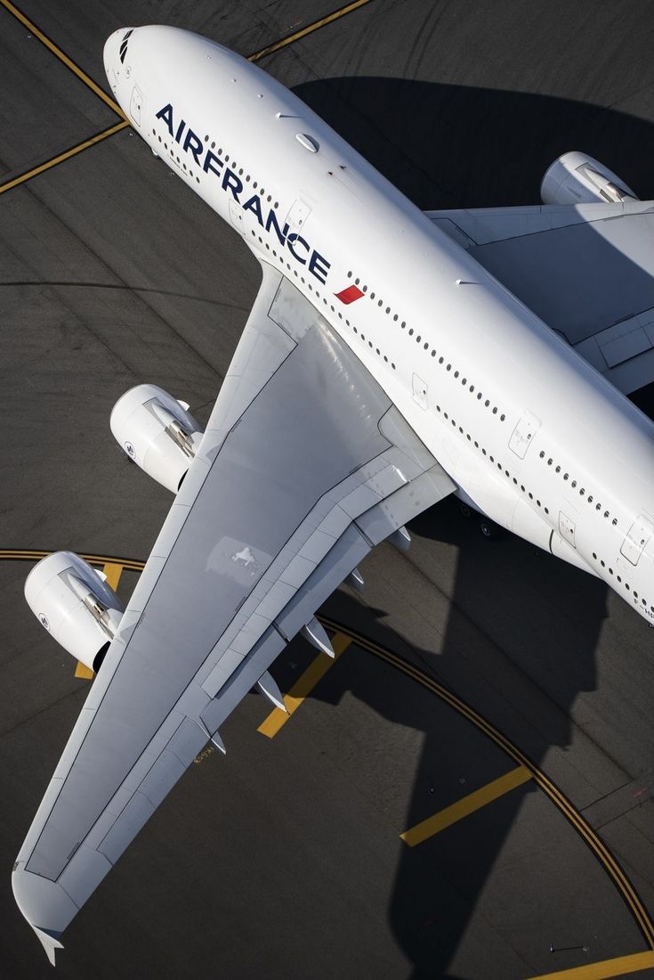 an airfrance airplane sitting on the tarmac at an airport, taken from above