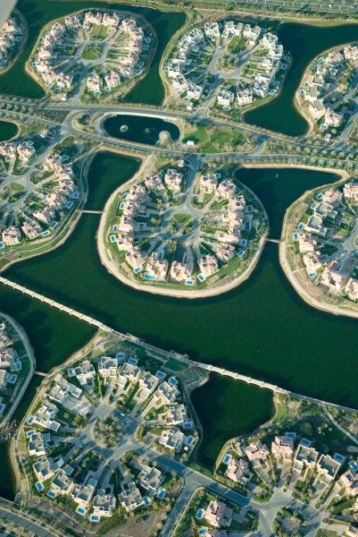 an aerial view of a city with lots of water