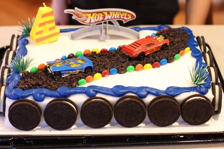 a birthday cake that is shaped like a train