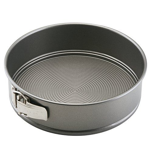 an aluminum pan with a handle on the side and a lid for it to be used