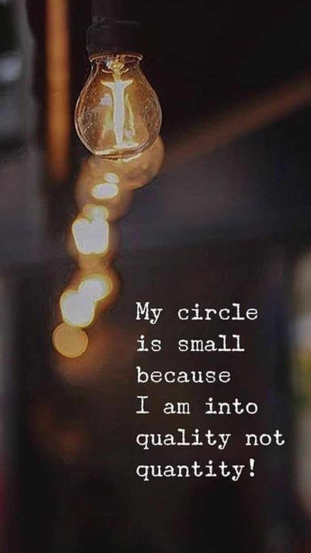 a light bulb hanging from the ceiling with a quote on it that reads my circle is small because i am into quality not quantity