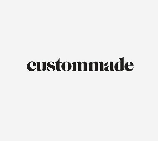 the word custom made written in black on a white background