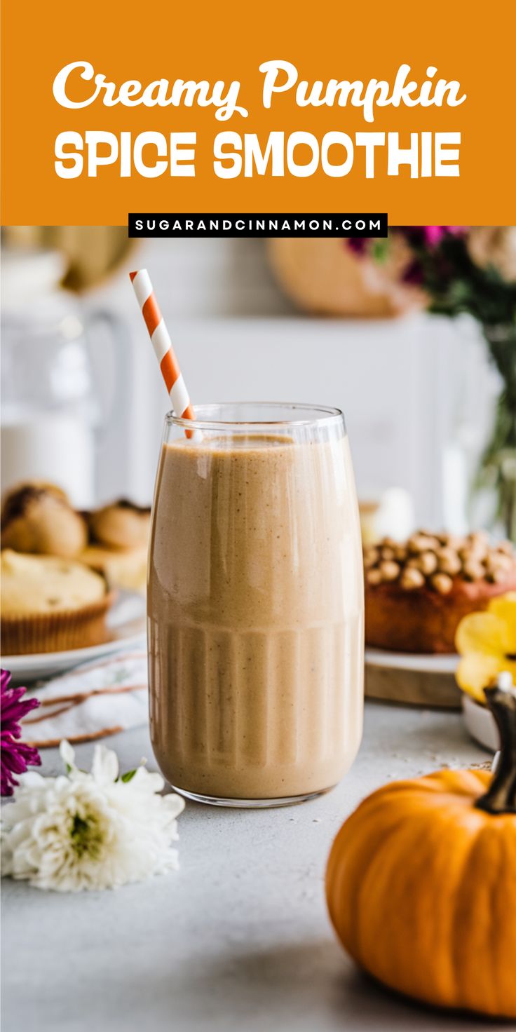 pumpkin spice smoothie in a glass on a table with flowers and muffins