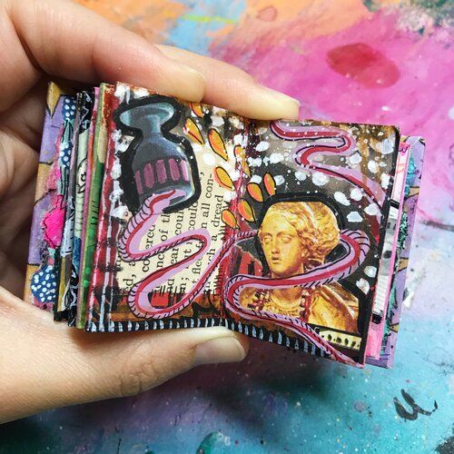 a hand holding a wallet with an image of a woman's face on it