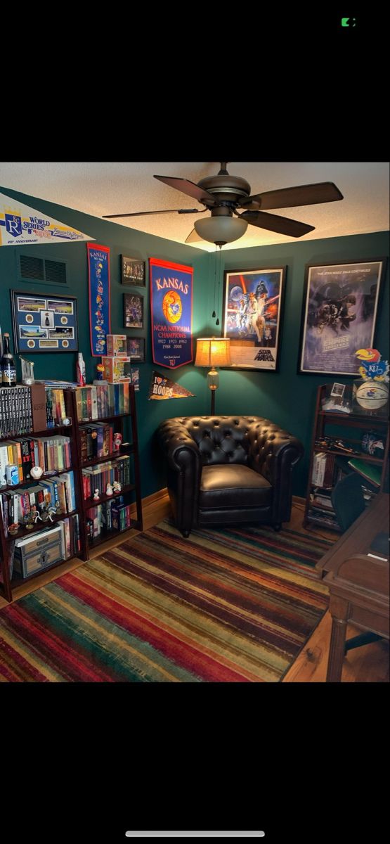 a living room filled with lots of books and furniture next to a book shelf full of movies