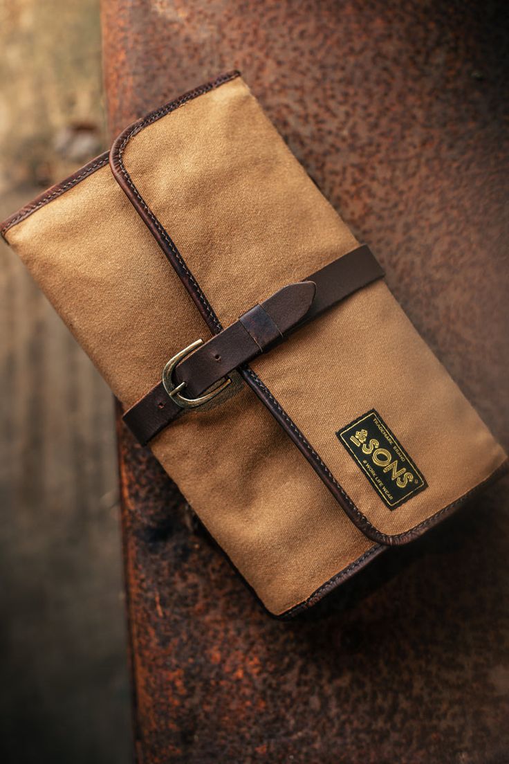 The &SONS Essentials Toilet Bag: Your All-Purpose Companion In the spirit of adventure, we present the &SONS EssentialsT oilet Bag- a traveller-seeking organisation for your overnight essentials, this Toilet Bag has got you covered. We understand that your essentials can vary greatly. That's why we've included a comb holder with an &SONS leather emboss, a toothbrush pocket, a scissor holder, a razor pocket, and even a pocket for your aftershave bottle. No matter what you carry, it will find its Overnight Essentials, Leather Braces, Son Clothes, Toilet Bag, Tool Roll, Stocking Fillers For Her, Leather Key Fobs, Military Gear, Aftershave