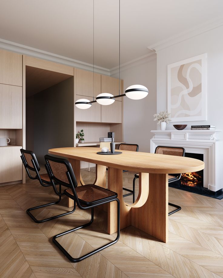 a dining room table with chairs and a fire place in the back wall behind it