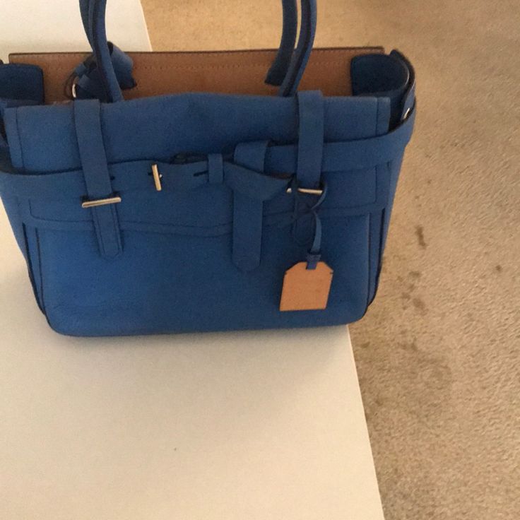 Medium Blue Tote Bag With Top Carry Handle, Chic Blue Box Bag, Designer Blue Bag With Double Handle, Designer Office Satchel Tote, Blue Shopping Bag With Top Carry Handle, Designer Office Tote Satchel, Luxury Blue Box Bag For Everyday, Modern Blue Satchel Box Bag, Tan Satchel With Top Handle For Errands