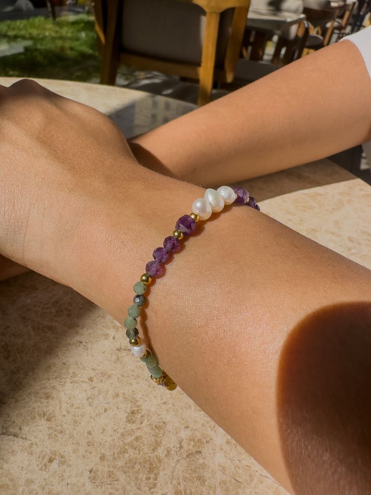 Explore inner wisdom and clarity with our Wisdom bracelet, energized with Amethyst and Emerald. Amethyst: A symbol of wisdom and spiritual insight, Amethyst provides clarity in life's chaos. Its purple hue enhances intuition and inner vision, calming the mind and promoting wisdom. Emerald: Symbolizing wisdom and growth, Emerald inspires intuition. Its energy grounds you, helping you appreciate the present and the surrounding wisdom. Together, Amethyst and Emerald offer wisdom and insight for self-discovery and spiritual growth. Wearing the Wisdom bracelet, may you access your inner wisdom, guiding your path with purpose. Spiritual Connection, Purple Hues, Spiritual Growth, Amethyst, Purple