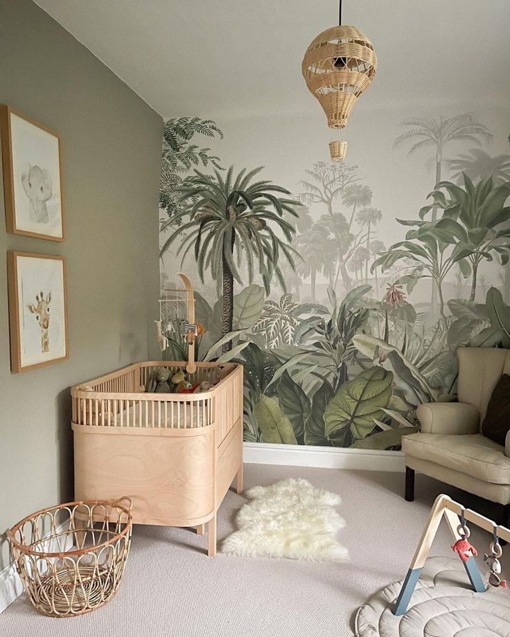 a baby's room decorated with palm trees