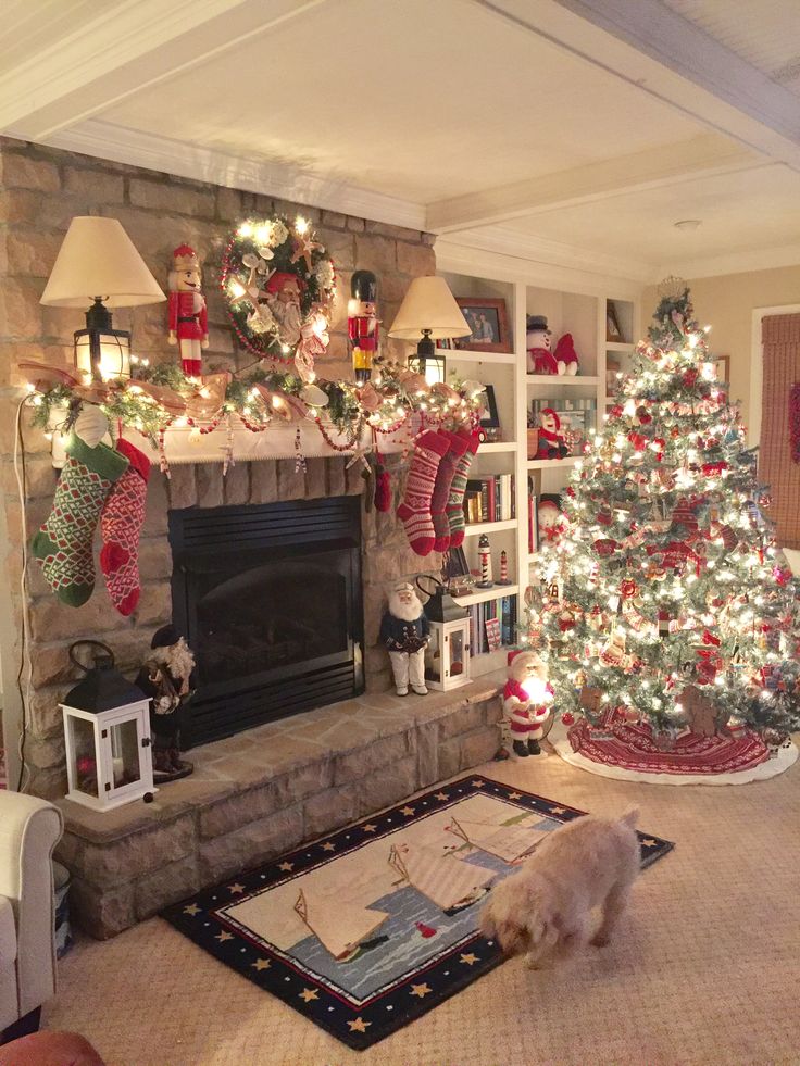 a living room with a christmas tree and fireplace