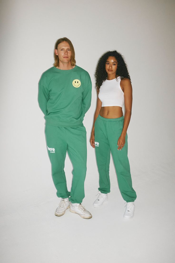 Designed to inspire your inner bravery, our OG graphic sweatpants have two side pockets, an interior adjustable drawstring, and a relaxed fit. GRAPHICS Front: 'Brave the Label' logo puff paint graphic Back: 'Smiley Face' graphic Back: 'We Are' puff paint graphic - "We are Resilient, Fearless, Daring, Day Dreamers, Reform Seekers, Human Beings. Brave the Label". COLORWAYSAvailable in Jet Black + Lucky Green MATERIALSOur sweatpants are made from 100% premium cotton. Made in Los Angeles from a soft Green Sporty Relaxed Fit Pants, Sporty Green Pants With Relaxed Fit, Green Relaxed Fit Sporty Pants, Sporty Green Relaxed Fit Pants, Green Joggers With Elastic Waistband For Streetwear, Green Relaxed Fit Joggers With Elastic Waistband, Green Sporty Pants For Leisure, Sporty Green Pants For Leisure, Sporty Green Leisure Pants