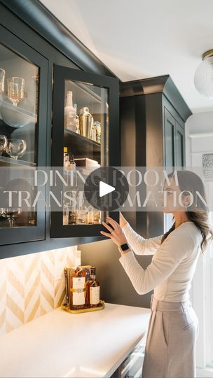 a woman standing in front of a kitchen counter