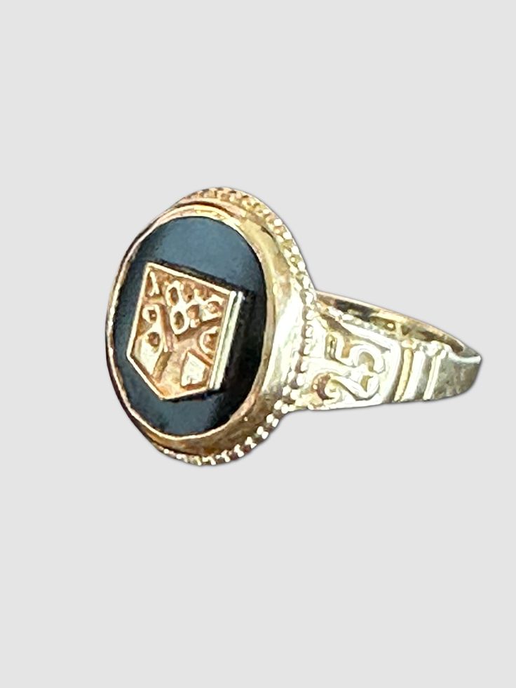 This ring is a traditional lasting symbol of hard work, friendships and milestones. This ring is classic in design that will be worn with pride for years to come. Our goal is to make class rings that are beautiful and represent the spirit of the school for which they are made. The black onyx stone provides a stricking backdrop to the 14k, 10k or SS shield that represents the school. Handmade and beautiful not just for the graduation season but for a lifetime. Onyx stone set in 14k, 10k or Sterli Traditional Oval Ring With 17 Jewels, Black Heirloom Jewelry For Ceremonial Occasions, Black Heirloom Jewelry For Ceremonial Use, Black Heirloom Ceremonial Jewelry, Traditional Oval Engraved Anniversary Ring, Heirloom Engraved Ring Jewelry, Vintage Ceremonial Signet Ring With Open Design, Vintage Ceremonial Open Signet Ring, Ceremonial Sterling Silver Rings With Polished Finish