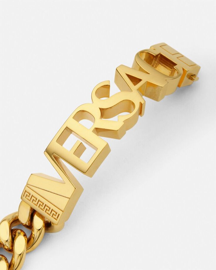 Versace Bracelet | Versace US Designer Logo Charm Bracelet Jewelry, Designer Jewelry Bracelet With Logo Charm, Designer Gold Jewelry With Logo, Designer Metal Bracelets With Logo Charm, Designer Gold Bracelets With Logo Charm, Modern Metal Jewelry With Logo Charm, Classic Gold Jewelry With Logo, Luxury Jewelry Gift With Metal Logo, Luxury Jewelry With Metal Logo For Gift