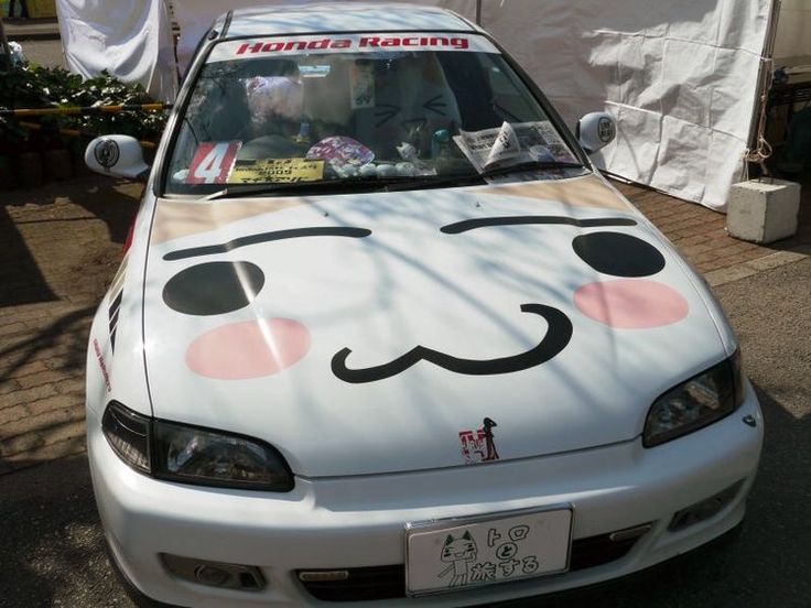 a white car with a face painted on it