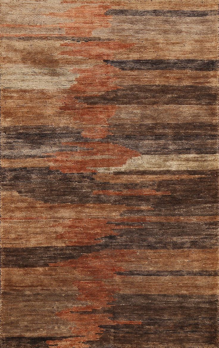 an area rug with different colors and patterns on it, including brown, beige, orange and