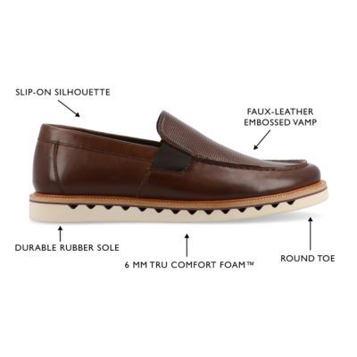 The Dallas loafer from Vance Co. blends sophistication and comfort with its 1-inch heel, slip-on design, and classic round toe. Crafted from faux leather this style offers a stylish alternative. The mesh lining, 6 mm Tru Comfort Foam footbed, and rubber outer sole ensure breathability and cushioned support, making the Dallas loafer a trendy and comfortable choice for various occasions. | Vance Co Men's Dallas Casual, Brown, 8M