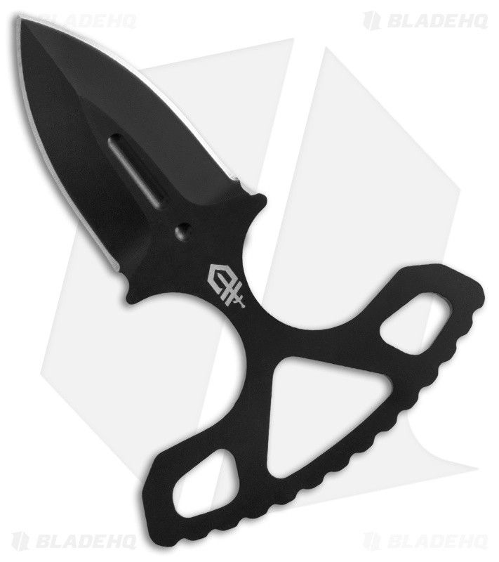 a black knife with an open blade on it's side and the blades are cut in half