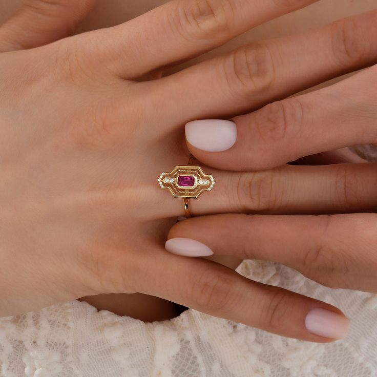 "Indulge in the timeless elegance of our 14K gold rings, meticulously crafted to enhance your personal style. Each ring is expertly made from genuine 14K gold, radiating a warm and luxurious glow that will captivate all who lay eyes on it. Our collection boasts an array of stunning designs, ranging from sleek and minimalist to intricate and ornate, ensuring there's a perfect ring to match your unique taste. Whether you're looking for a statement piece to dazzle at special occasions or a delicate band for everyday elegance, we have something to suit every occasion. Crafted with exceptional attention to detail, our 14K gold rings showcase exquisite craftsmanship that stands the test of time. The high-quality gold ensures lasting durability, allowing you to cherish your ring for years to come Exquisite Gold Ruby Gemstone Ring, Elegant Ruby Ring With Center Stone For Promise, Heirloom Style Lab-created Ruby Diamond Ring As Gift, Heirloom Style Lab-created Ruby Diamond Ring Gift, Heirloom Red Gold Signet Ring, Timeless Gemstone Signet Ring For Anniversary, Elegant Promise Ruby Ring With Halo Setting, Elegant Rings With Lab-created Ruby And Accent Stones, Heirloom Ruby Signet Ring In Yellow Gold