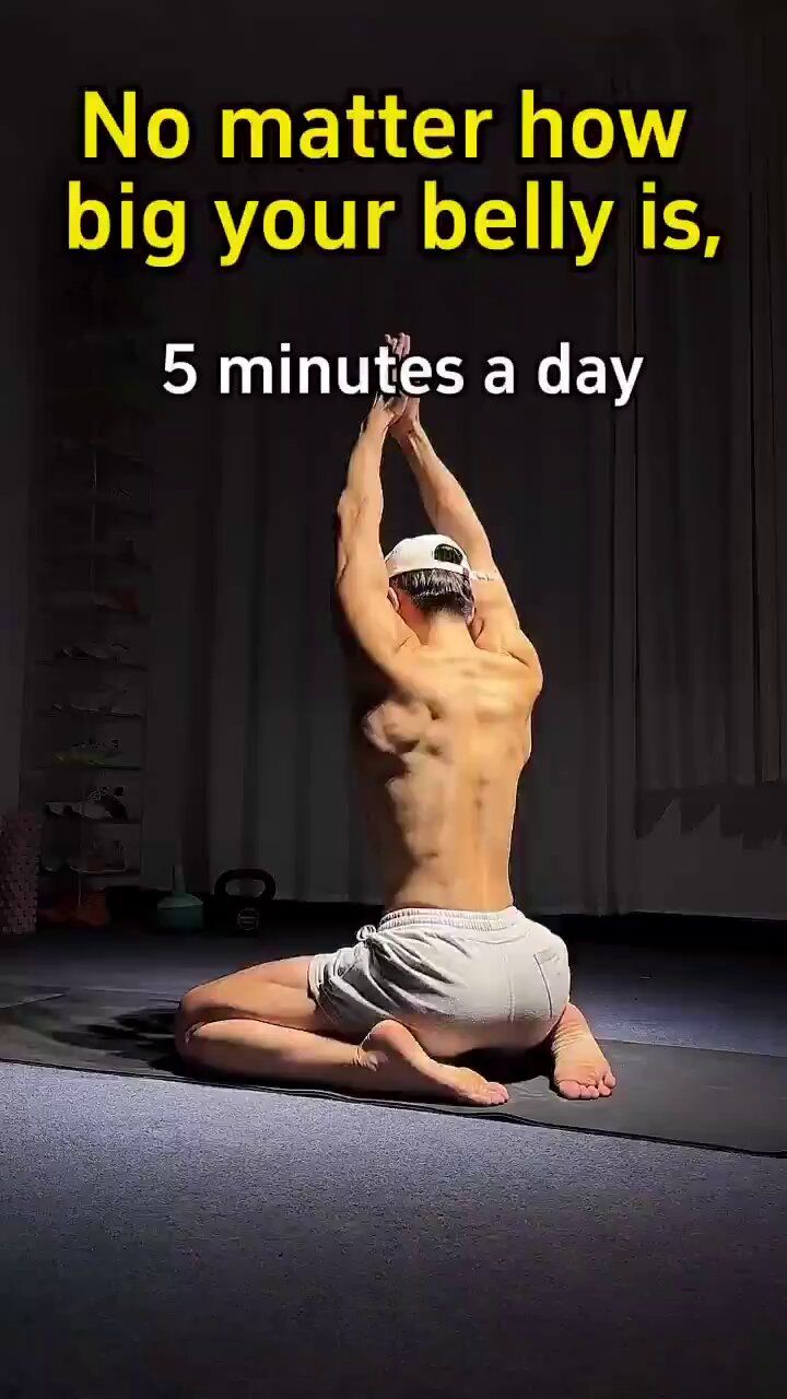 a man is doing yoga on the floor with his hands in the air and an ad that says no matter how big your belly is, 5 minutes a day