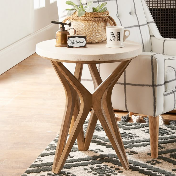 a table with a plant on it in front of a chair