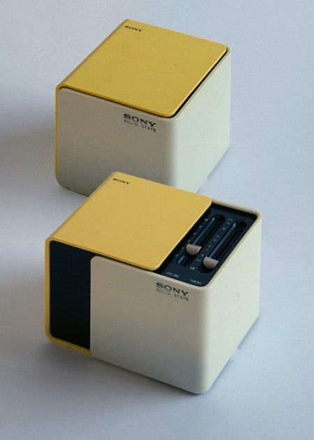 two yellow and white boxes sitting next to each other