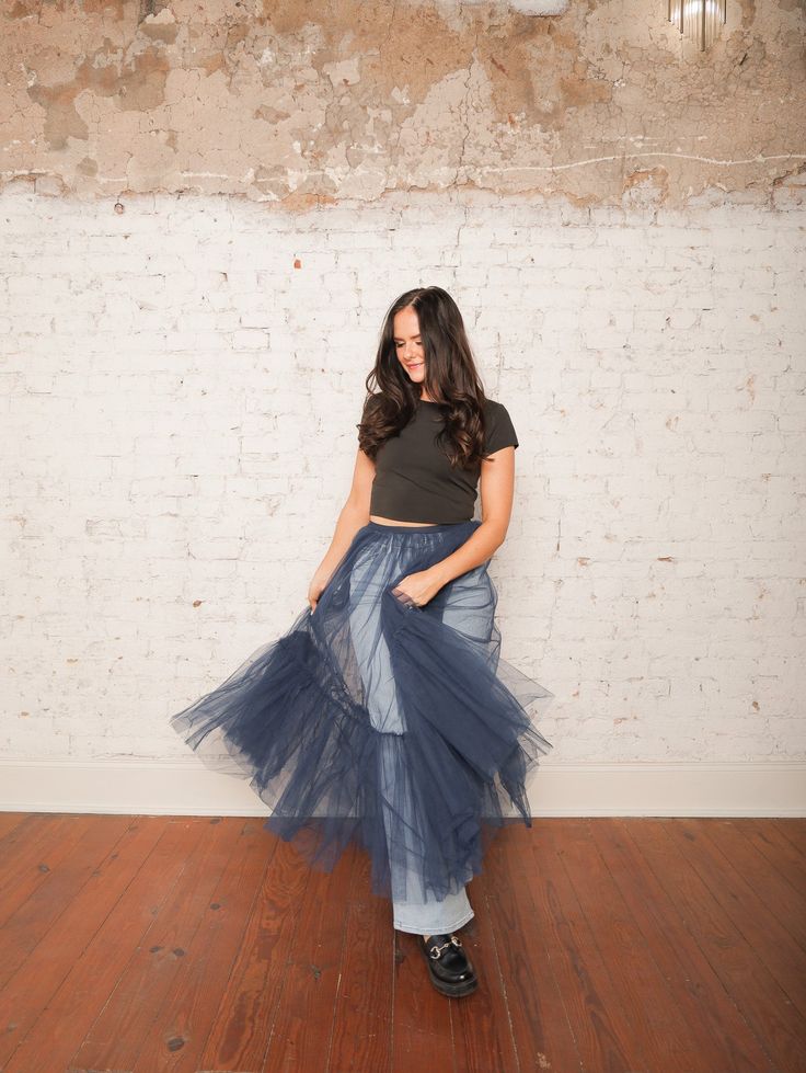 Our Yvonne Tulle Skirt is the ultimate statement piece for layering! With its high-rise elastic waistband and sheer, layered tulle, this midi skirt adds a dreamy touch to any outfit. Pair it with a fitted top and heels for a standout evening look, or wear it over jeans for an edgy daytime vibe. Details High Rise Pull-On Style Elastic Waistband Sheer Layered Tulle Midi Length Size recs: 0-4 Small, 4-6 Medium, 8-10 Large Provides lots of stretch Relaxed Full Tulle Maxi Skirt, Spring Sheer Stretch Skirt, Flared Tulle Maxi Skirt With Lining, Chic Tulle Flared Maxi Skirt, Chic Tiered Sheer Skirt, Chic Voluminous Tulle Maxi Skirt, Chic Sheer Tiered Skirt, Chic Flared Tulle Maxi Skirt, Chic Tulle Lined Maxi Skirt