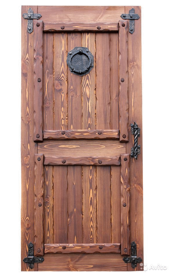 an old wooden door with metal handles