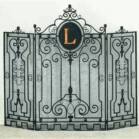 a wrought iron gate with the letter l on it's front and side panels