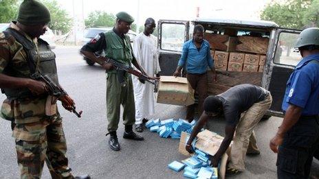 Security officials search a vehicle along the Gombe-Maiduguri (archive shot)ri expressway in Nigeria