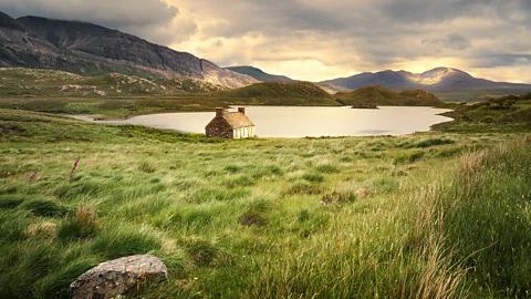 Bothy by lake in UK (Credit: Getty Images)