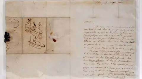 An old letter written in french. there are the remains of a red seal on it