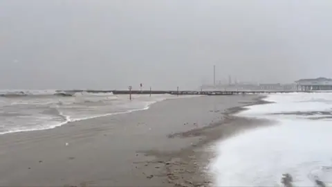 Snow fall at beach in Houston, Texas.