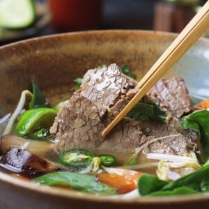 A recipe image shows cooked beef brisket to tender, sliced and served in Vietnamese pho broth