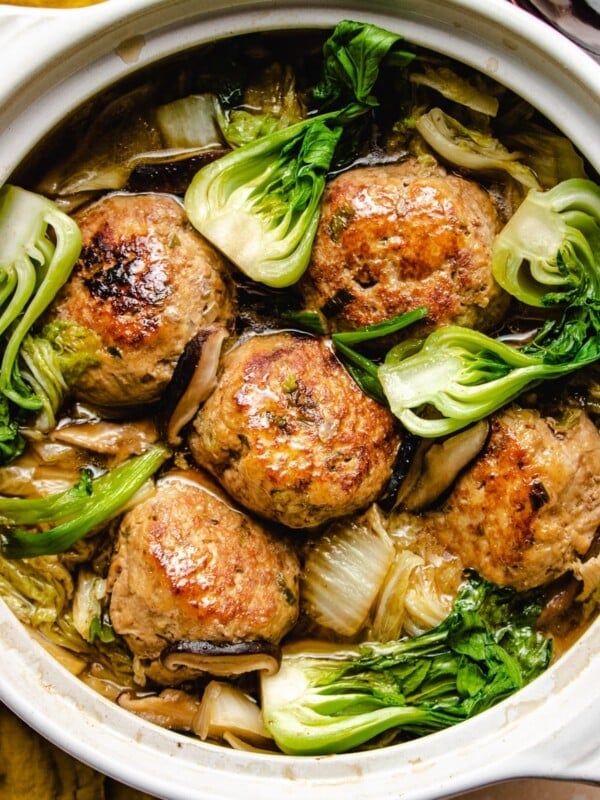 Photo shows jumbo meatballs and napa cabbage stew in a big white clay pot