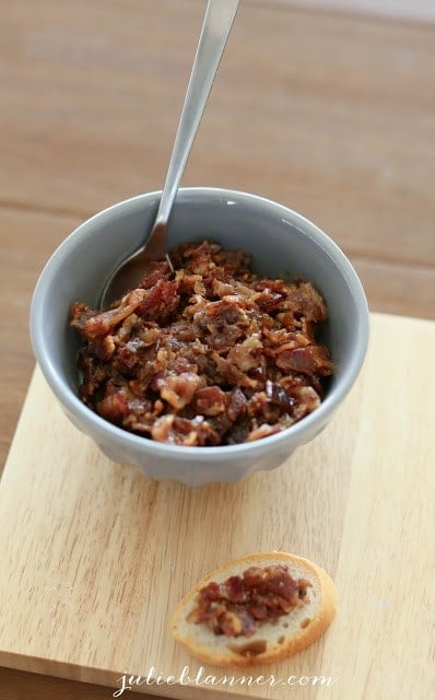 A bowl of Bacon Jam on wooden table.