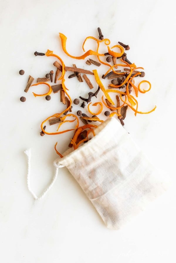 A pile of mulling spices on a white surface.